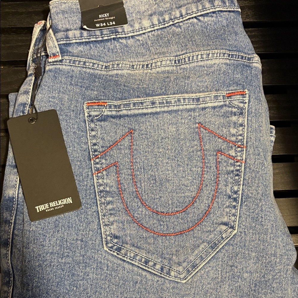True Religion Men’s Ricky Relaxed Jeans in Light Blue with Red Stitching